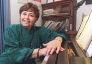 Neva Pilgrim at her piano in her home in 1996.