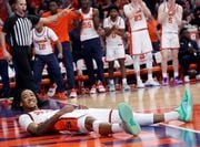 Syracuse Orange guard Judah Mintz (3) smiles after getting fouled and knocked to the floor. The Syracuse Orange basketball team take on the Louisville Cardinals at the JMA Wireless Dome Feb. 7, 2024.  (Dennis Nett | dnett@syracuse.com)