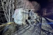 In this image provided by New York State Department of Environmental Conservation, train cars lie on their sides after a train derailed, Wednesday evening, Feb. 7, 2024, in Valley Falls, New York. Authorities say 10 cars of a 94-car cargo train carrying plastic pellets and cooking oil, derailed in upstate New York, with two ending up in a river. (Basil Seggos | New York State Department of Environmental Conservation via AP)