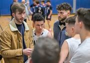 From left, Mater Dei boys basketball head coach Aidan Carpenter and assistant coach Brandon Wick meet with their players during a time out as they take on Pulaski in boys basketball at the Tipp Hill Community Center, Jan. 4, 2024.