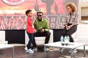 PHOENIX, ARIZONA - FEBRUARY 12: (L-R) Aaiden Diggs, Trevon Diggs, and Sage Steele speak onstage during The Players Tailgate Hosted By Bobby Flay and presented by Bullseye Event Group for Super Bowl LVII on February 12, 2023 in Phoenix, Arizona. (Photo by Jesse Grant/Getty Images for Bullseye Event Group )