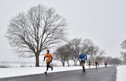 Syracuse runners brave 18 mph winds, steady snow, and temps in the low 30s while running the Couch Potato 5k at Onondaga Lake Park, Liverpool, NY, Sunday February 4, 2018. 
Scott Schild | sschild@syracuse.com SYR