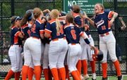 The Liverpool girls congratulate Cassandra Wiggins after she hit a home run to put them up 1-0 against Monroe-Woodbury in the New York State Class AA Championship, Saturday, June 11, 2022 at Moriches Athletic Complex.